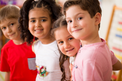 Four children standing together