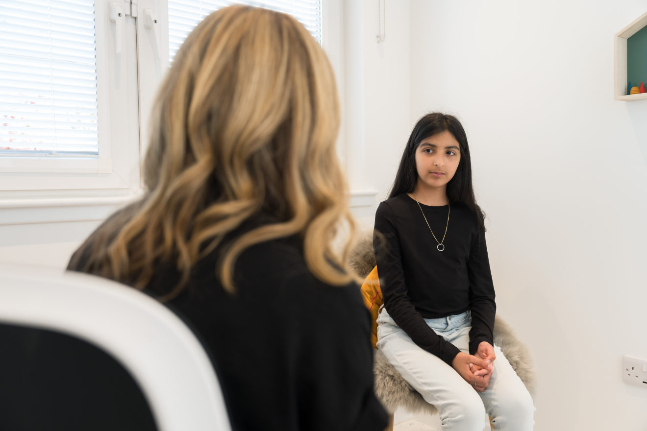 Child in conversation with an adult